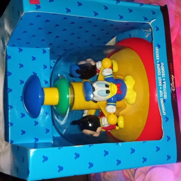 The Disney stores Spinning top for babies 6 months and up. - Picture 1 of 4